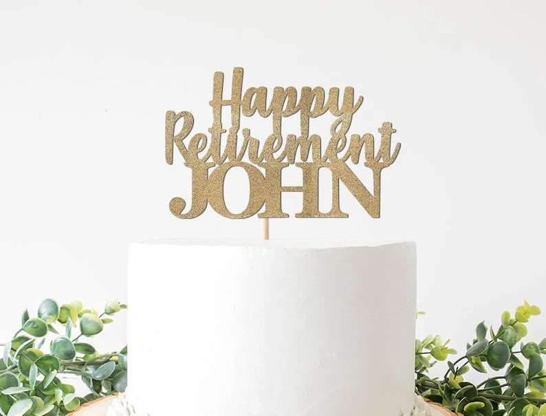 May include: Gold glitter cake topper with the text "Happy Retirement John".
