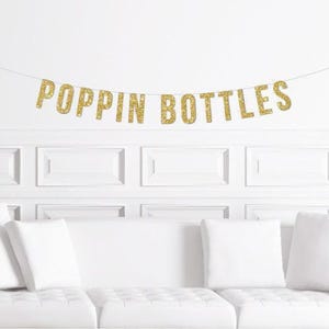 Poppin Bottles | Trendy New Year's Eve Party Banner Gold Glitter Popping