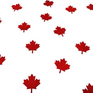 May include: Red glitter maple leaf confetti scattered on a white background. The leaves are a vibrant red colour and have a textured, sparkling appearance. Ideal for crafts, decorations, or themed events.