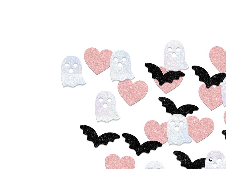 May include: A scattering of Halloween-themed confetti on a white background. The confetti includes glittery white ghosts, pink hearts, and black bats. The shapes are scattered across the frame, creating a festive and playful design.