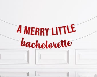 May include: A red glitter banner with the text "A Merry Little Bachelorette" hanging on a white wall.