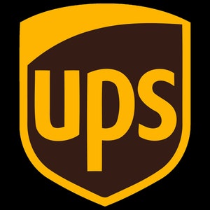 May include: The UPS logo is a brown shield with a gold outline. The letters UPS are in gold and are centred on the shield.