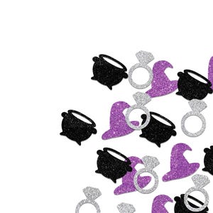 May include: Glittery Halloween-themed confetti in black, silver, and purple. The confetti includes witch hats, engagement rings, and cauldrons. The items are scattered on a white background, creating a festive and celebratory atmosphere.