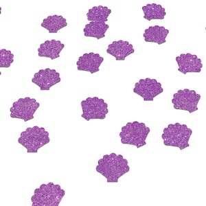 May include: Purple glitter seashells confetti.  These sparkly purple seashells are perfect for adding a touch of whimsy to your next party or craft project.