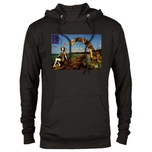 May include: Black hooded sweatshirt with a vintage postcard print featuring a woman sitting on a rock with a sea serpent behind her. The postcard has a red stamp and the text "Loch Ness Monster"