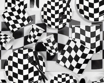 May include: A collection of black and white checkered party supplies, including plates, cups, napkins, and cutlery. The items are arranged on a checkered surface, creating a cohesive theme for a racing or party event.