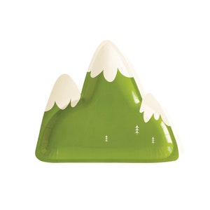 May include: A green paper plate shaped like a mountain range with three peaks. The mountain tops are white, and small white trees are printed on the green slopes. The plate has a ridged edge.