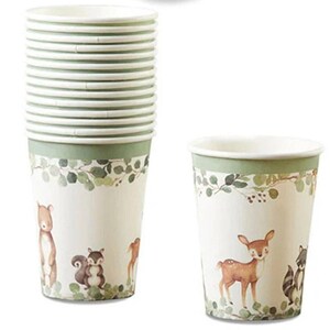May include: A stack of paper cups with a woodland animal theme. The cups are white with a green band at the top and a forest scene featuring a bear, deer, squirrel, and raccoon. The cups are designed for beverages.