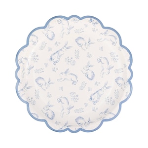 May include: A white paper plate with a scalloped edge and a light blue border. The plate is decorated with a repeating pattern of blue watercolor-style bunnies and floral elements.