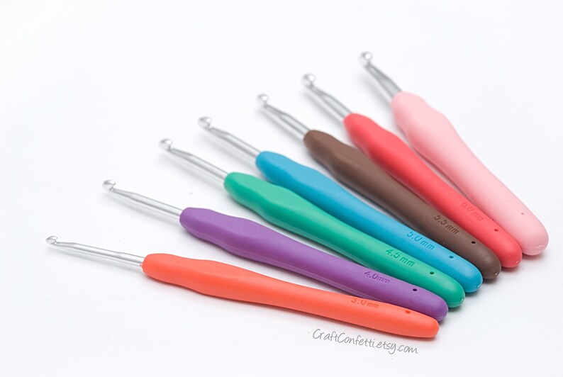 May include: A set of seven colorful crochet hooks with different sizes, ranging from 3.0 mm to 6.0 mm. The hooks are made of metal with a smooth, ergonomic handle.