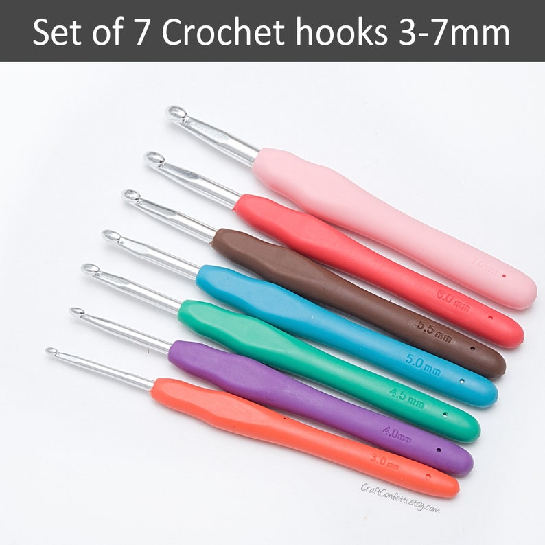 May include: Set of seven crochet hooks with colorful plastic handles. The hooks are labeled with sizes 3.0 mm, 4.0 mm, 4.5 mm, 5.0 mm, 5.5 mm, and 6.0 mm.