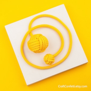 Yellow Monkey Fist rope cat toy. Handmade pet toy ball. Macrame toy to hunt. Chasing toy