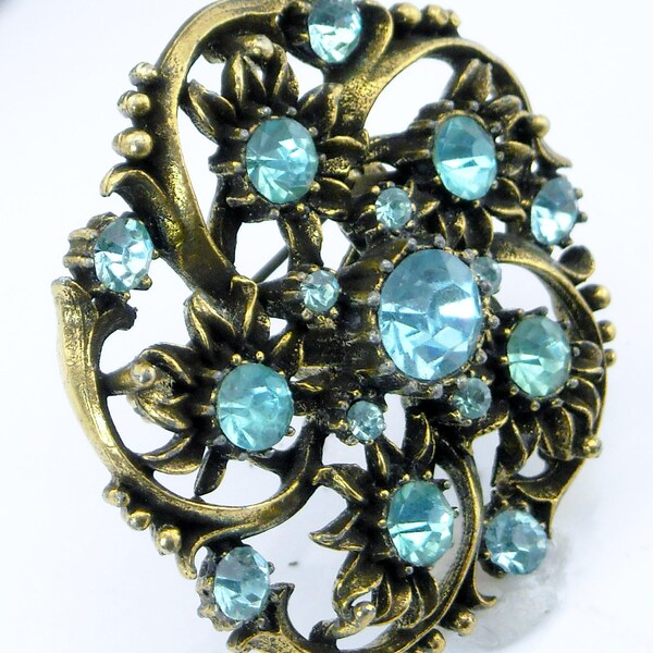 CORO 1940's Brooch, Designer round aqua blue rhinestone, antiqued gold tone swirl pin