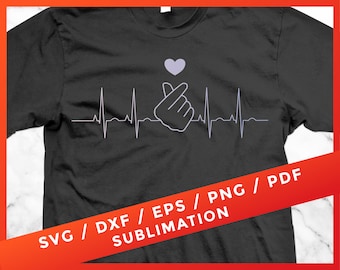 May include: A black t-shirt with a white heart and a hand making a heart shape with the fingers. The text "SVG / DXF / EPS / PNG / PDF SUBLIMATION" is printed on the bottom of the shirt.