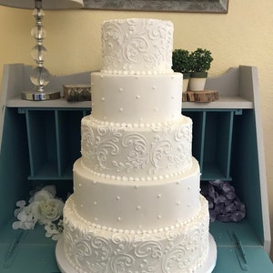 Five tier swirl and dot faux wedding cake