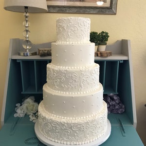 Five tier swirl and dot faux wedding cake