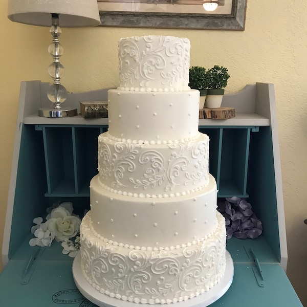 Five tier swirl and dot faux wedding cake