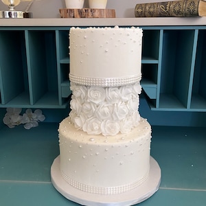 Faux wedding cake with pearls and flowers