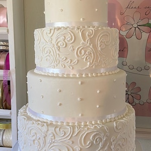 Four tier swirl and dot faux/fake wedding cake