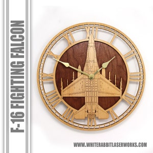 May include: A wooden clock with Roman numeral markings and a cutout design of an F-16 Fighting Falcon jet. The clock face is made of a dark wood with a light wood frame. The clock hands are gold.