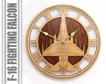 May include: A wooden clock with Roman numeral markings and a cutout design of an F-16 Fighting Falcon jet. The clock face is made of a dark wood with a light wood frame. The clock hands are gold.