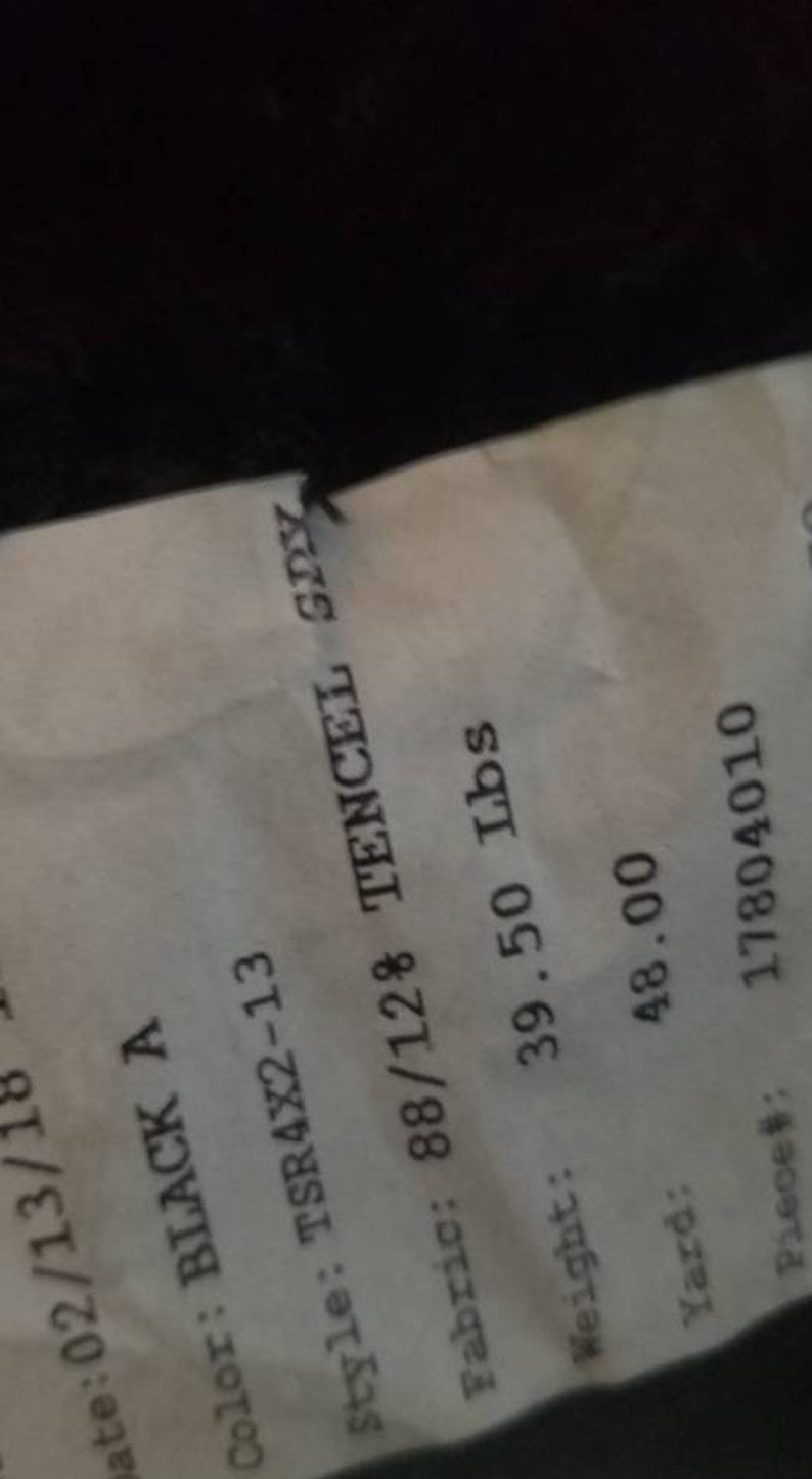May include: A receipt with the date 02/13/18. The color is BLACK A, style TSR4X2-13, and fabric is 88/12% TENCEL SPY. The weight is 39.50 lbs, and the yard is 48.00. The piece number is 17804010.