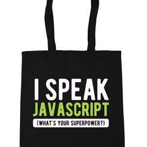 May include: Black tote bag with white text saying "I SPEAK JAVASCRIPT", with "JAVASCRIPT" in green. Below, in smaller white text, it says "{WHAT'S YOUR SUPERPOWER?}". The bag has black handles, ideal for carrying items.