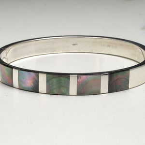 Vintage armband i silver och abalonesnäckor med gångjärn.