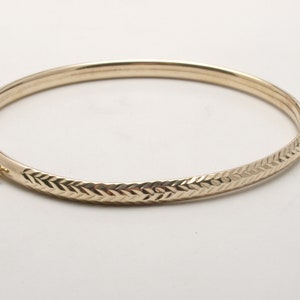 Gold bracelet with engraved detail