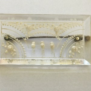 Vintage reverse carved lucite brooch