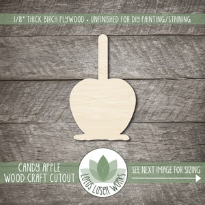 May include: Unfinished candy apple wood craft cutout made from 1/8" thick birch plywood. The apple shape has a stick and a base, perfect for DIY painting or staining. The image also includes the text "Candy Apple Wood Craft Cutout".