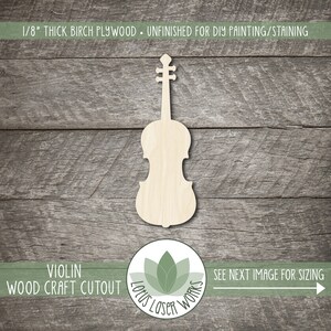 May include: A light-colored, unfinished birch plywood violin cutout, perfect for DIY projects. The text "1/8" THICK BIRCH PLYWOOD - UNFINISHED FOR DIY PAINTING/STAINING" is at the top. The text "VIOLIN WOOD CRAFT CUTOUT" is at the bottom.