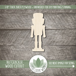 May include: Unfinished wooden nutcracker cutout, 1/8 inch thick birch plywood.  The cutout is ready for DIY painting or staining.  The image shows the nutcracker standing on a woodgrain background.
