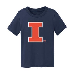 May include: A navy blue toddler t-shirt with a large, red "I" in a white outline. The "I" is a stylized letter with a white outline. The shirt has a white "TM" in the bottom right corner.