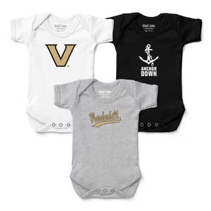 May include: Three baby onesies in white, black, and gray. The white onesie has a gold and black "V" logo. The black onesie features a white anchor with the text "ANCHOR DOWN." The gray onesie has "Vanderbilt" in gold script.