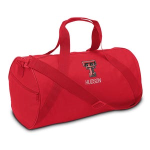 May include: Red duffel bag with a black and red "T" logo and the name "HUDSON" embroidered on the front.