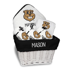May include: A white wicker basket with a black liner holds a set of white towels and washcloths. Each item features a cartoon beaver graphic and the name "MASON" in black. The basket's liner also displays the name "MASON" in white.