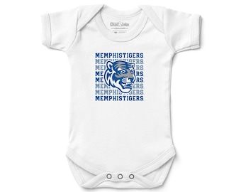 May include: White baby onesie with a blue and gray tiger head graphic and the text "MEMPHISTIGERS" repeated multiple times.