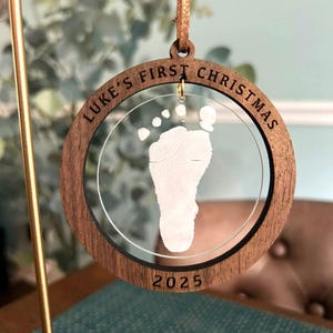 Baby&#39;s first Christmas 2025 custom engraved footprint wooden and acrylic ornament