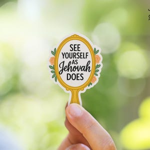 May include: A gold mirror with a floral design and the text "See yourself as Jehovah does".