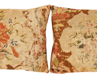 A pair of antique decorative English needlepoint rug pillows, size 1'10" x 1'6" each
