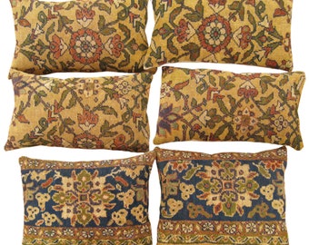 A Set of Antique Traditional Floral Carpet Pillows ; size 2'0” x 1'3” and 1'10" x 1'6"