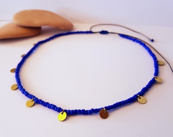 blue bead choker with tiny coin charms