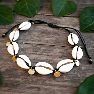 shell anklet with gold coin charms, black cord seashell layering ankle bracelet, tribal brass macrame festival body jewelry, bohemian style