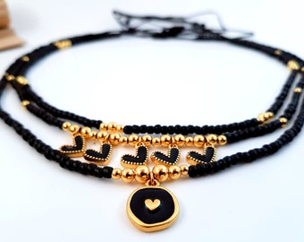 layered necklace set with heart charms gold black