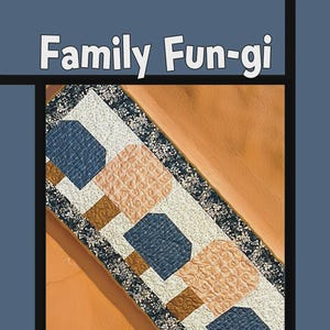 May include: A quilted table runner featuring a repeating pattern of blue, peach, and brown shapes, framed by a floral border. The text "Family Fun-gi" is at the top. Design by Tricia Lynn Maloney.