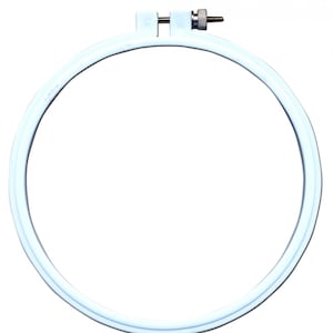 May include: White plastic embroidery hoop with a screw tightening mechanism.