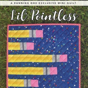May include: A mini quilt with a blue background patterned with colorful stars. The quilt features yellow and gray pencil designs with pink erasers. The text "Lil Pointless" is displayed at the top, and "Running Doe Quilts" is at the bottom.