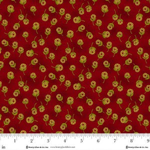 May include: Red fabric with a repeating pattern of yellow and green floral buds. The buds have a dotted texture and are set against a deep red background. The fabric is marked with an inch ruler along the bottom.