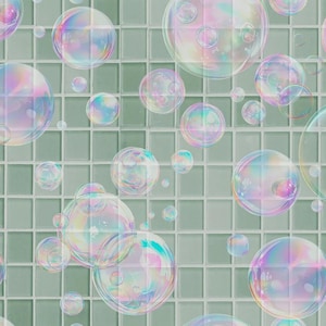 May include: A seamless pattern of iridescent bubbles floating against a light green tiled background. The bubbles vary in size and reflect a spectrum of colors, creating a whimsical and airy design. The tiles are square and evenly spaced.